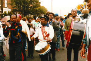 Early masqueraders as Leeds Wet Indian Carnival